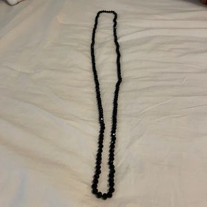Long black bead necklace